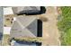 Aerial view of a single-Gathering home, showing the roof, landscaping, and neighborhood at 5470 Beaver Ridge Dr, Cumming, GA 30040