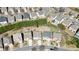 Aerial view of a neighborhood showcasing similar style homes with driveways and backyards at 5470 Beaver Ridge Dr, Cumming, GA 30040