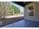 Covered patio overlooking a large, fenced backyard at 5470 Beaver Ridge Dr, Cumming, GA 30040