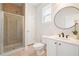 Bathroom showcases tile flooring, modern fixtures, and a walk-in shower at 5470 Beaver Ridge Dr, Cumming, GA 30040