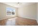 Bedroom featuring neutral walls, hardwood floors and bright window at 5470 Beaver Ridge Dr, Cumming, GA 30040