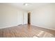 Bedroom featuring hardwood flooring and closet entrance at 5470 Beaver Ridge Dr, Cumming, GA 30040