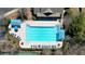 A large, inviting swimming pool features sun loungers and is flanked by sunshades for relaxation at 5470 Beaver Ridge Dr, Cumming, GA 30040