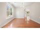 Bright dining room featuring hardwood floors, a chandelier, and an arched entryway at 5470 Beaver Ridge Dr, Cumming, GA 30040