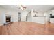 Inviting living room with a stone fireplace, hardwood floors, and an open floor plan at 5470 Beaver Ridge Dr, Cumming, GA 30040