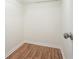 A spacious walk-in closet features hardwood floors and a chrome rack at 5470 Beaver Ridge Dr, Cumming, GA 30040