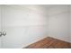 Walk-in closet with hardwood floors and shelving at 5470 Beaver Ridge Dr, Cumming, GA 30040