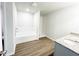 Modern bathroom featuring double vanity, soaking tub with tile surround, and separate walk-in shower at 5518 Legacy Trl, Douglasville, GA 30135