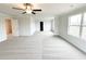 Bright, spacious bedroom with neutral carpet and large windows offering plenty of natural light at 5518 Legacy Trl, Douglasville, GA 30135