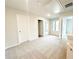 Upstairs secondary bedroom with neutral colors and access to two additional rooms at 5518 Legacy Trl, Douglasville, GA 30135