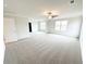 Bright, spacious bedroom with neutral carpet, ceiling fan, and large windows offering plenty of natural light at 5518 Legacy Trl, Douglasville, GA 30135