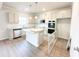 Stylish kitchen with an island, stainless steel appliances, and neutral color scheme at 5518 Legacy Trl, Douglasville, GA 30135