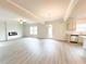 Large living room boasting an electric fireplace, stainless steel appliances, and an open floor plan at 5518 Legacy Trl, Douglasville, GA 30135