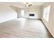 Living room showcasing the fireplace with windows letting in plenty of natural light at 5518 Legacy Trl, Douglasville, GA 30135