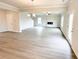 Spacious living room with a modern fireplace and large windows for ample natural light at 5518 Legacy Trl, Douglasville, GA 30135