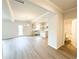 Bright living room with an open floor plan connecting seamlessly to the kitchen and bathroom at 5518 Legacy Trl, Douglasville, GA 30135