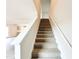 Carpeted staircase leading to the upper level of the home at 5518 Legacy Trl, Douglasville, GA 30135