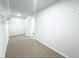 Expansive walk-in closet featuring neutral carpeting and white walls, offering a blank canvas for organization at 5518 Legacy Trl, Douglasville, GA 30135