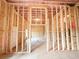 Unfinished basement with framed walls showcasing construction progress at 5547 Bent Grass Way, Douglasville, GA 30135