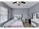 Bedroom featuring large window and a neutral color scheme, offering a relaxing atmosphere at 901 Blue Sky Rdg, Snellville, GA 30078