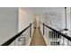 Hallway leading to a living room with marble fireplace and luxury vinyl plank flooring at 901 Blue Sky Rdg, Snellville, GA 30078