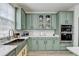 Stylish kitchen with shaker cabinets, stainless appliances, and light countertops at 901 Blue Sky Rdg, Snellville, GA 30078