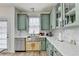 Modern kitchen with stainless steel appliances and custom cabinets at 901 Blue Sky Rdg, Snellville, GA 30078