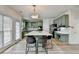 Spacious kitchen with an island, green cabinets, modern appliances, and ample natural light at 901 Blue Sky Rdg, Snellville, GA 30078