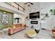 Bright living room with fireplace, shelves, and view of the staircase at 901 Blue Sky Rdg, Snellville, GA 30078