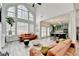 Open concept living room featuring two-story windows and eat-in kitchen at 901 Blue Sky Rdg, Snellville, GA 30078