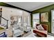 Open floor plan featuring a living room and dining room, all with light wood flooring at 901 Blue Sky Rdg, Snellville, GA 30078