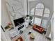 Open-concept living room with high ceilings, large windows, and a sleek fireplace at 901 Blue Sky Rdg, Snellville, GA 30078