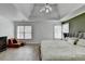 Spacious main bedroom with tray ceilings, an accent wall, and luxury vinyl flooring at 901 Blue Sky Rdg, Snellville, GA 30078