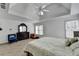 Spacious main bedroom with tray ceilings, an accent wall, and luxury vinyl flooring at 901 Blue Sky Rdg, Snellville, GA 30078