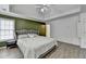 Spacious main bedroom with tray ceilings, an accent wall, and luxury vinyl flooring at 901 Blue Sky Rdg, Snellville, GA 30078