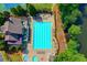 Aerial view of a community pool surrounded by lounge chairs and lush greenery at 901 Blue Sky Rdg, Snellville, GA 30078