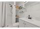 Neat bathroom featuring a shower, vanity, and shelving for extra storage at 127 Oldenburg Dr, Riverdale, GA 30274