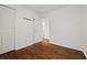 Bright bedroom features hardwood floors and a closet with ample storage space at 127 Oldenburg Dr, Riverdale, GA 30274