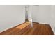 Bright bedroom showcasing hardwood floors, closet space, and natural lighting at 127 Oldenburg Dr, Riverdale, GA 30274