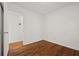 Cozy bedroom boasts hardwood floors and a neutral color palette at 127 Oldenburg Dr, Riverdale, GA 30274