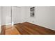 Bedroom showcasing hardwood floors, closet space, and bright, natural light at 127 Oldenburg Dr, Riverdale, GA 30274
