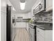 Modern kitchen featuring updated appliances, stylish backsplash, and ample storage space at 127 Oldenburg Dr, Riverdale, GA 30274