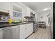 Functional kitchen with stainless steel appliances, white cabinets, and modern lighting at 127 Oldenburg Dr, Riverdale, GA 30274