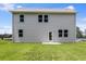 Backyard of home featuring lush lawn and modern design with large windows on the back exterior at 209 Groveton Ct, Euharlee, GA 30145