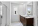 Bathroom featuring double vanity with dark cabinets, and a glass-enclosed shower at 209 Groveton Ct, Euharlee, GA 30145