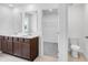 Bathroom featuring double vanity with dark cabinets, tile floor, and a separate water closet with toilet at 209 Groveton Ct, Euharlee, GA 30145