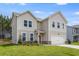 Charming two-story home with a well-manicured lawn and a welcoming front porch at 209 Groveton Ct, Euharlee, GA 30145
