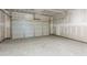 Spacious two car garage featuring concrete flooring with unfinished drywall at 209 Groveton Ct, Euharlee, GA 30145