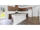 Bright kitchen features granite counters, stainless steel appliances and hardwood floors at 209 Groveton Ct, Euharlee, GA 30145