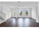 Open-concept living room with hardwood floors and bright natural light at 209 Groveton Ct, Euharlee, GA 30145